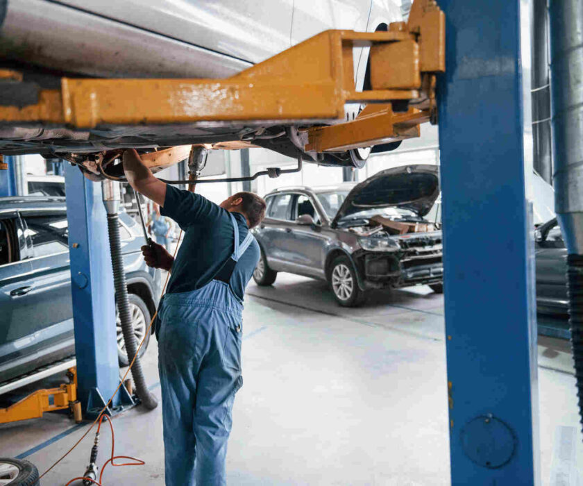 repairman doing auto collision repair on a vehicle in Minnesota